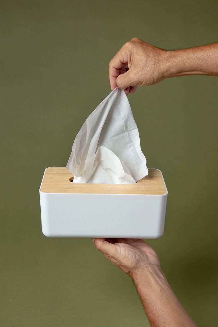 person holding white nasal handkerchief 23 2149091413